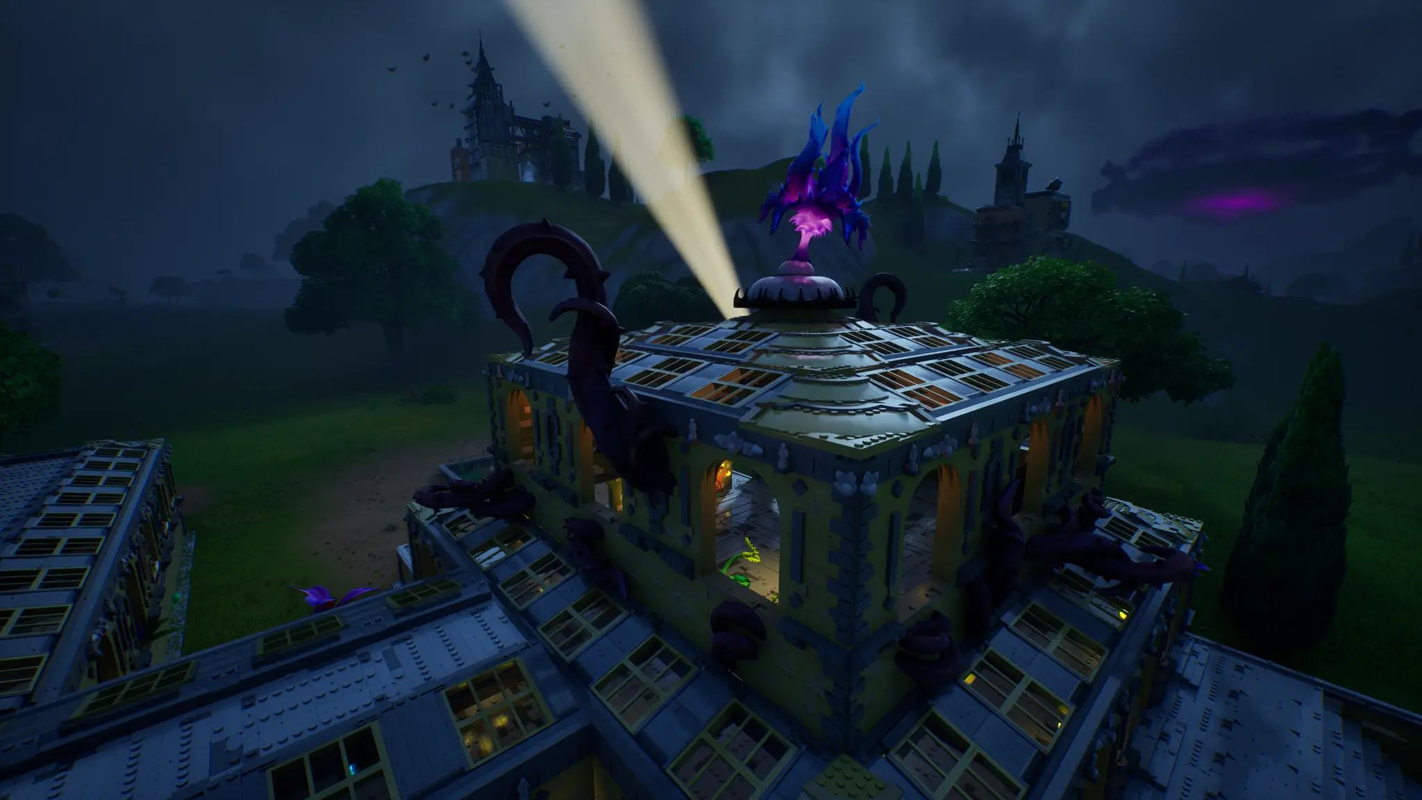 The Bat-Signal beaming from a rooftop at night in LEGO Fortnite Odyssey